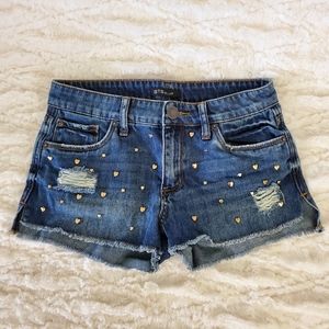 Heart studded destroyed denim shorts